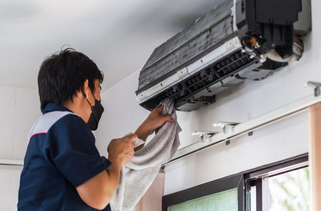 A Climate Systems employee performing AC installation in Allison Park, PA, using specialized tools and expertise to ensure excellent results.