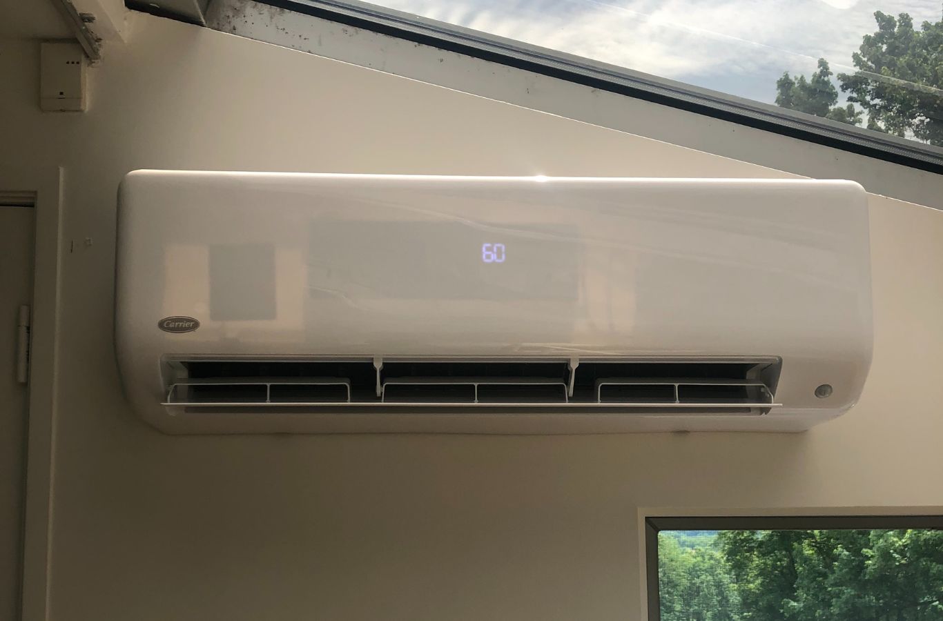 A Climate Systems team member working on AC installation in Hampton Township, PA, highlighting the benefits of expert service for home comfort.