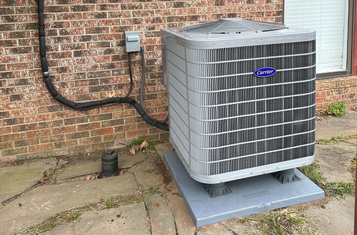 A Climate Systems employee conducting heat pump repair in Adams Township, PA, demonstrating the effectiveness of professional local service.