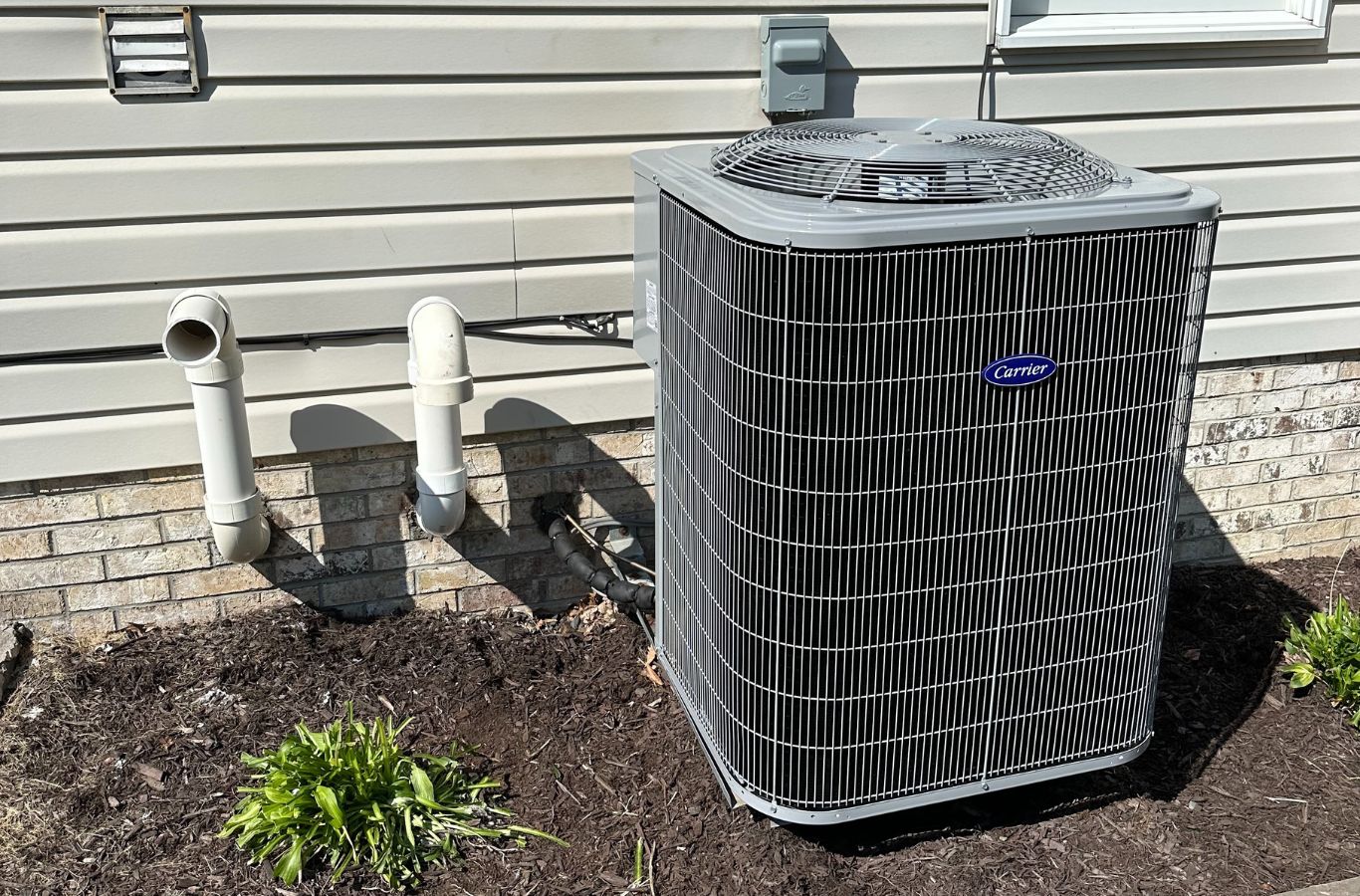 A Climate Systems team member conducting heat pump repair in Mars, PA, showcasing how professional service enhances comfort and reliability.