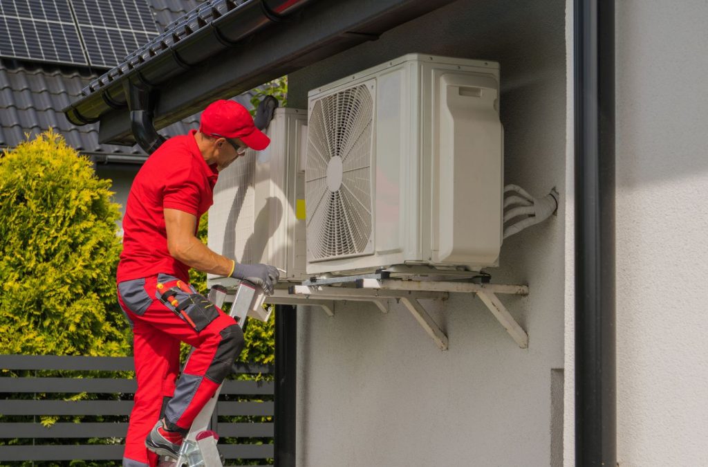 A Climate Systems technician performing heat pump repair in Cranberry Township, PA, using advanced tools and diagnostics to ensure reliable system restoration.