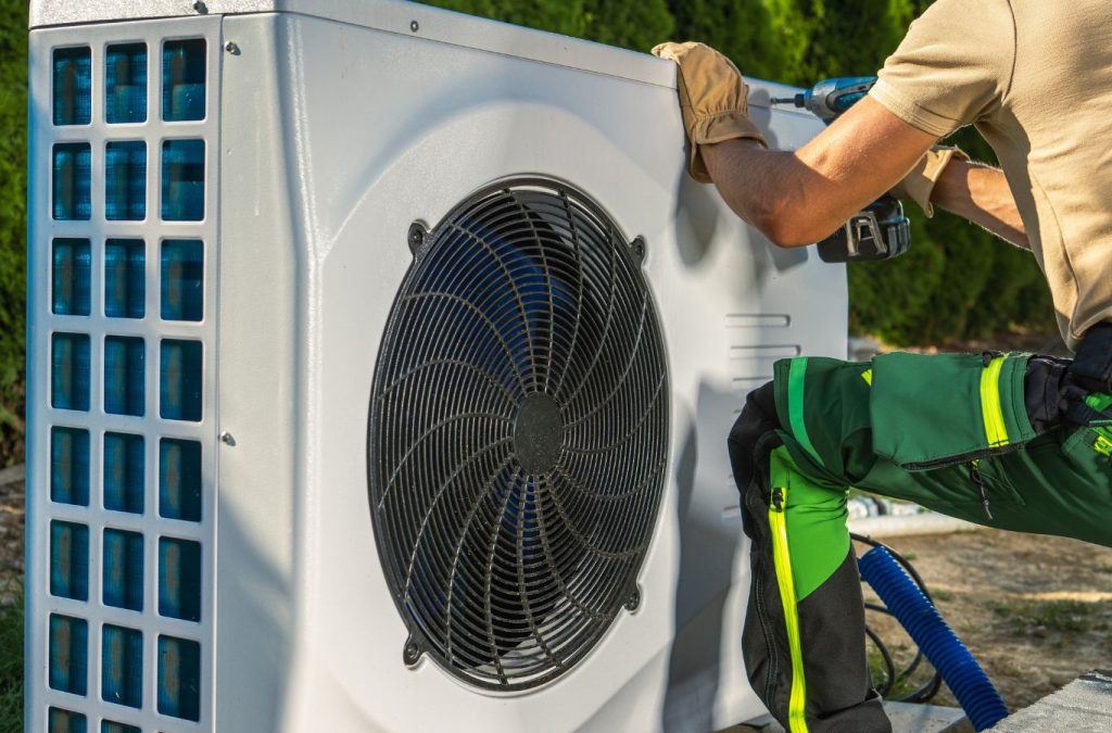 A Climate Systems technician offering heat pump repair in Valencia, PA, utilizing advanced diagnostics to restore system efficiency and performance.