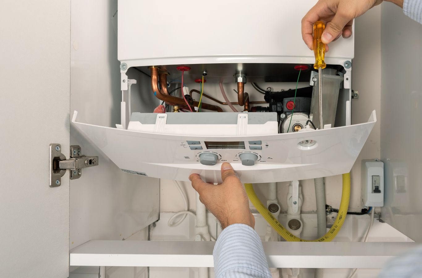 Climate Systems team member installing high-efficiency boiler in Cranberry Township, PA showcasing professional setup and reliable heating performance.