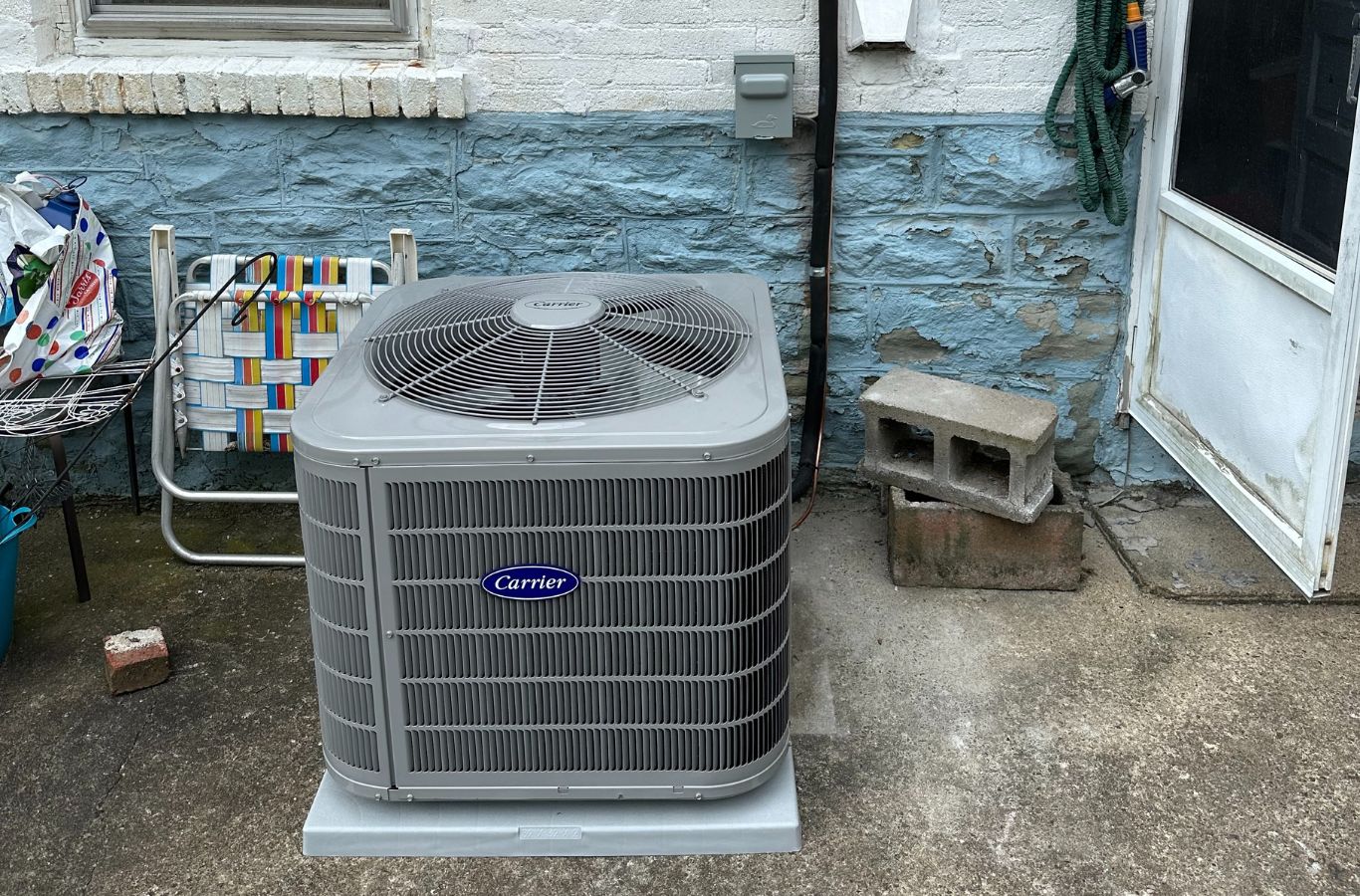 Climate Systems expert maintaining a heat pump in Franklin Park, PA ensuring dependable comfort. Heat Pump Maintenance Near Me