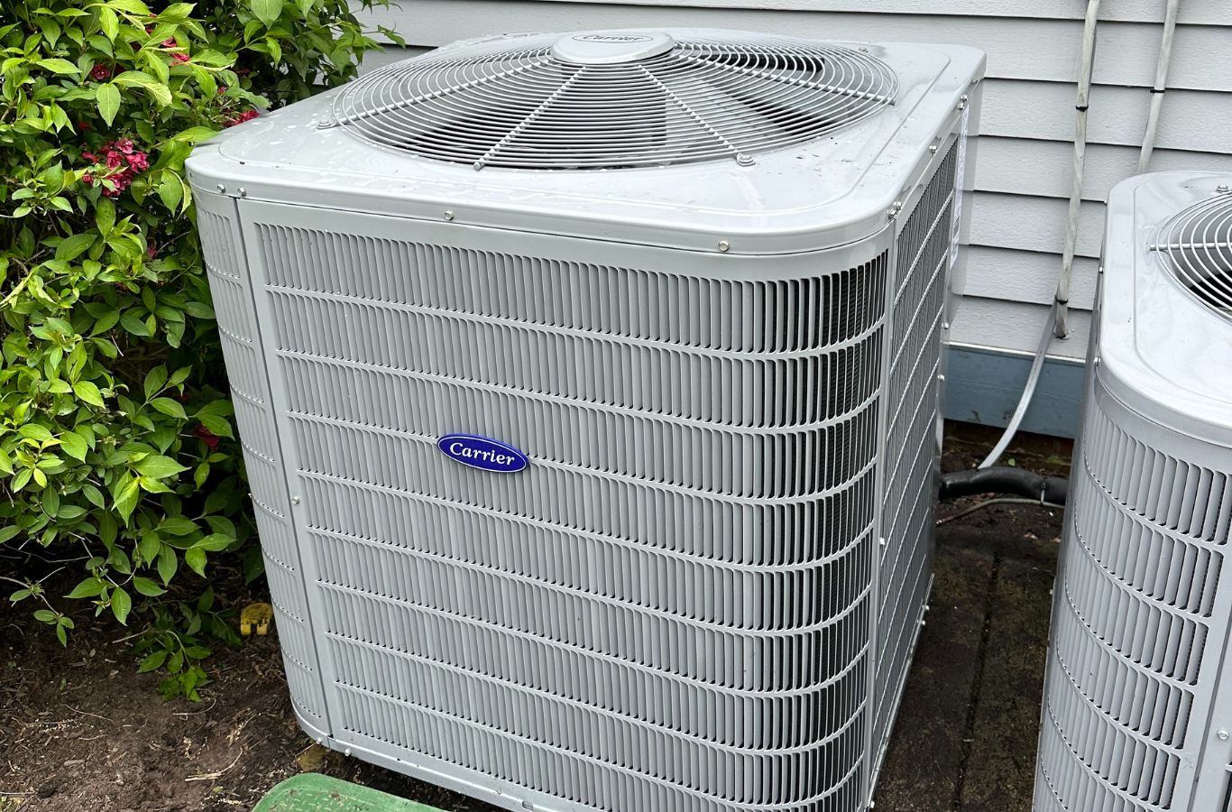 Climate Systems team servicing a heat pump in Adams Township, PA for improved efficiency and reliability