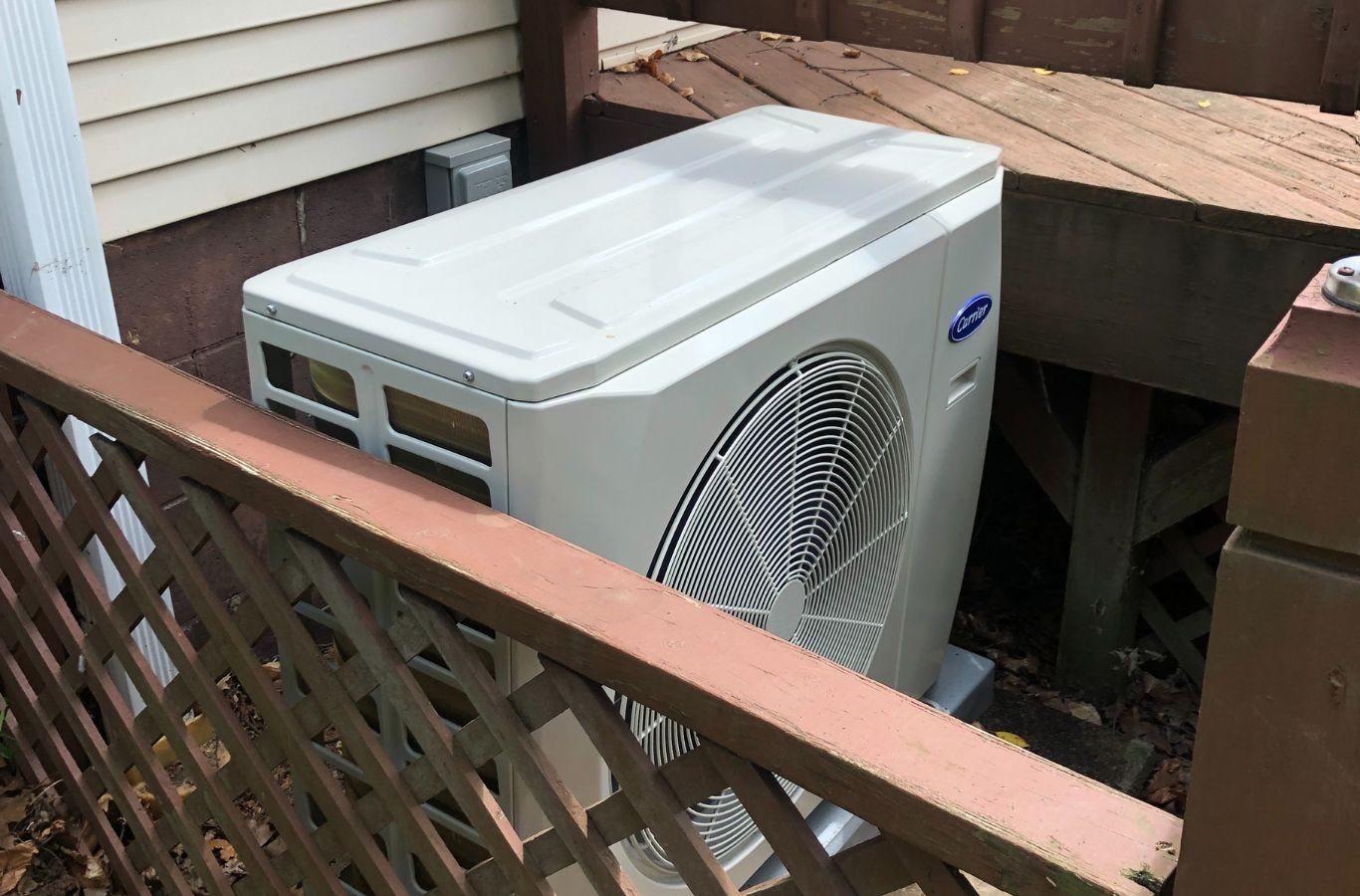 Climate Systems expert inspecting cooling equipment during an emergency AC repair at a Gibsonia, PA property.